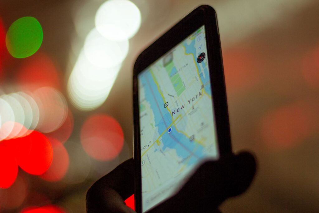 A photo of a mobile phone showing a map of Manhattan, New York.